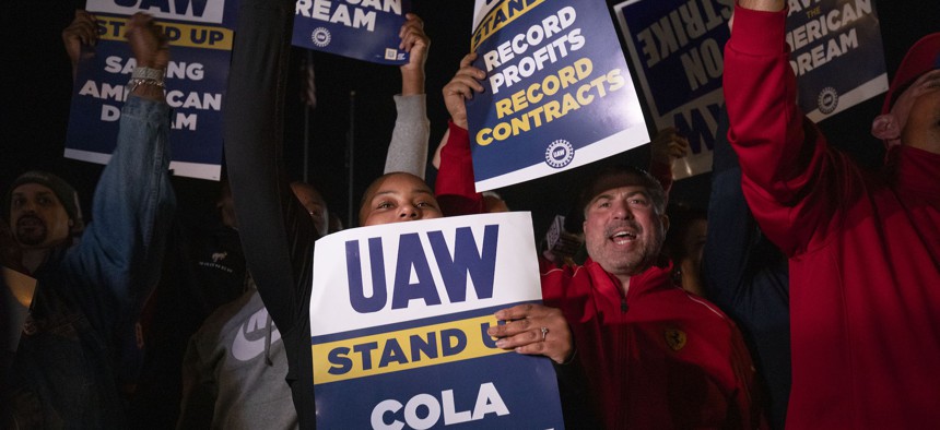 Supporters and workers cheer as United Auto Workers members go on strike at the Ford Michigan Assembly Plant on September 15, 2023 in Wayne, Michigan. 