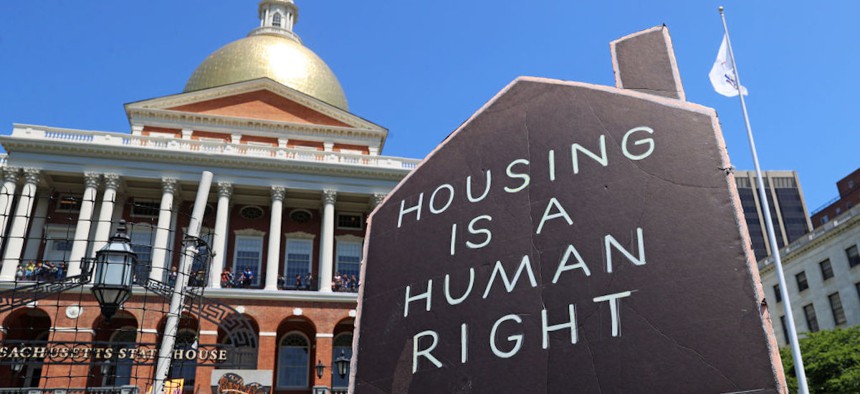 A housing demonstration on the front steps of the Massachusetts State House was well attended with those asking for rent control and help with housing. 
