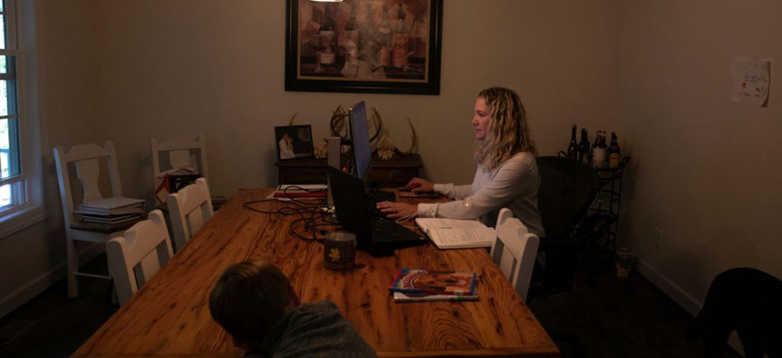 Hanna Mauck works from home Oct. 7, 2020, in Powhatan, Virginia. The Maucks live without access to broadband internet. Mauck said she uses a hot spot on her phone to access the internet, but the connection is not reliable for Zoom calls. 