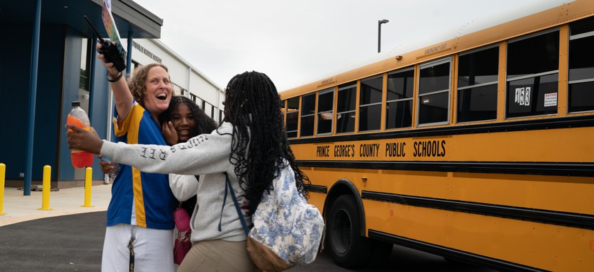 School buses pull up with children heading to their first day at the new Hyattsville Middle School in August.