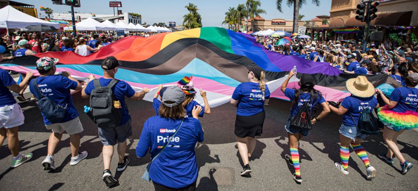 Parade participants carry a Progress Pride flag during San Diego Pride Parade on July 15, 2023 in San Diego, California.