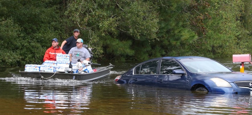 Rescue workers navigate flooded waters on Sept. 20, 2019, in Beaumont, Texas. 