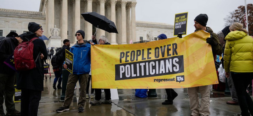 Demonstrators rally for voting rights outside the U.S. Supreme Court to hear oral arguments in the Moore v. Harper case Dec. 7, 2022, in Washington, DC. The Moore v. Harper case stems from the redrawing of congressional maps by the North Carolina GOP-led state legislature following the 2020 Census. The map was struck down by the state supreme court for partisan gerrymandering that violated the state constitution. 