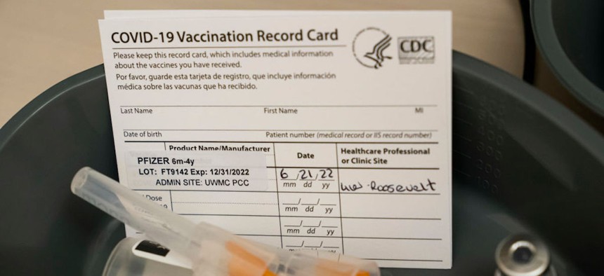 Doses of the Pfizer Covid-19 vaccine and vaccination record cards await patients at UW Medical Center - Roosevelt on June 21, 2022 in Seattle, Washington.