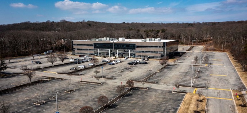 Aerial view of an large empty parking lot outside an office building in Melville, New York on March 2, 2022. State leaders across the country have called for employees to return to in-person work, including Nebraska Gov. Jim Pillen who recently ordered an end to remote work for state employees by Jan. 2.