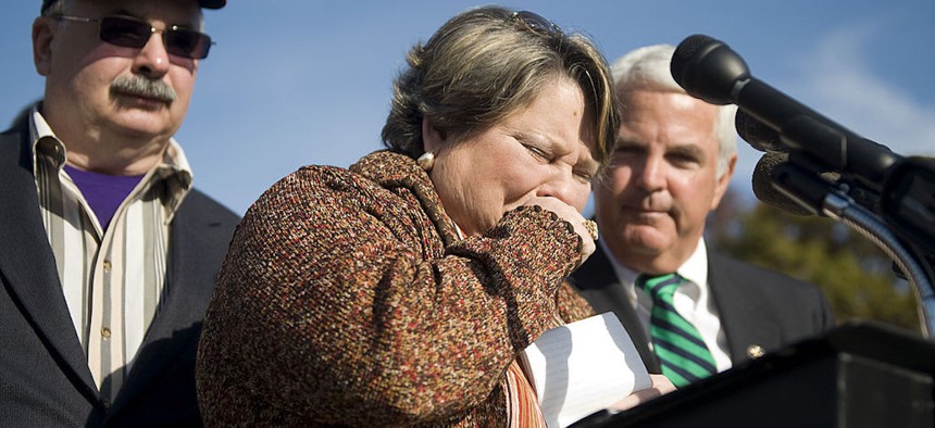 Florence Corcoran, of Slidell, Louisiana, breaks down while telling her story of how her unborn baby died in 1989, as a result of her insurance provider refusing to cover her doctor's request that she be hospitalized in the last days of her pregnancy. Corcoran spoke at a news conference in Nov. 4, 2009.