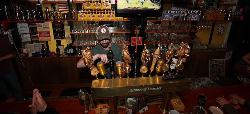 A server pours a beer in celebration of the Black Star Beer Barter event, during which residents and tourists compete in a show for a chance to win a year’s supply of Black Star beer, on Feb. 4, 2012 in Whitefish, Montana. 