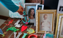 Susan Stevens adjusts a memento of her daughter Toria at her home in Lewisville, North Carolina, on March 11, 2019. Stevens lost her 22-year-old daughter to an opioid overdose in 2018 after years of her daughter struggling with addiction.