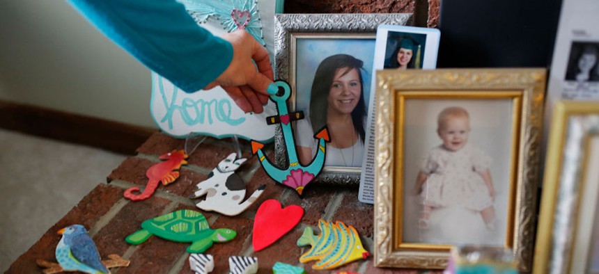 Susan Stevens adjusts a memento of her daughter Toria at her home in Lewisville, North Carolina, on March 11, 2019. Stevens lost her 22-year-old daughter to an opioid overdose in 2018 after years of her daughter struggling with addiction.