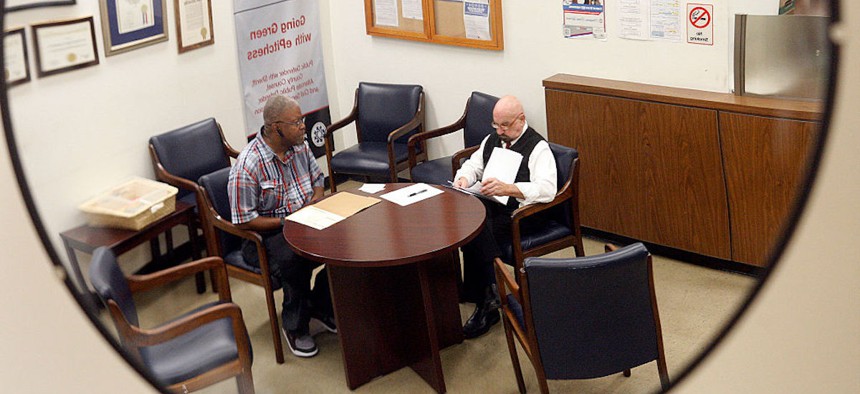John Garbin (right) is photographed at the Los Angeles Public Defenders office on April 16, 2014 in Los Angeles. Garbin is helping Winfred White (left) fild a motion to have his criminal record expunged. 