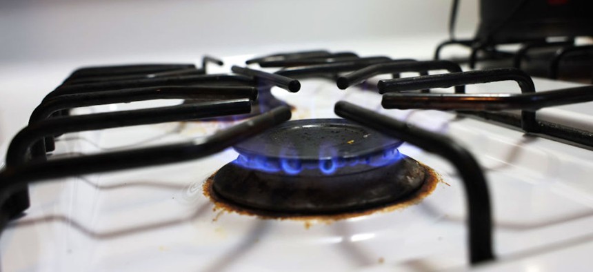A flame burns on a gas stove on April 28, 2023, in New York City. Gov. Kathy Hochul announced that starting in 2026, New York will require new buildings to be zero-emissions as part of this year’s budget and ban fossil fuel combustion in most new buildings under seven stories.