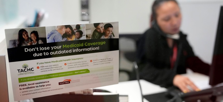A reminder about Medicaid coverage is displayed as Trina Le, eligibility supervisor team lead, works at Hope Clinic, 7001 Corporate Dr., Tuesday, May 30, 2023, in Houston. 