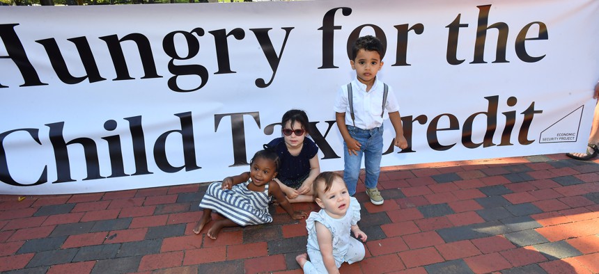 Parents and caregivers with the Economic Security Project gathered outside the White House in September to advocate for the child tax credit.