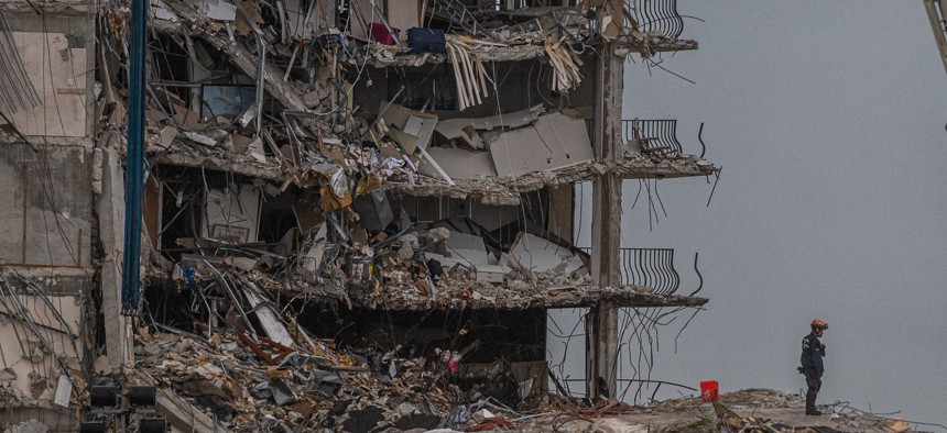 Search and Rescue teams look for possible survivors in the partially collapsed 12-story Champlain Towers South condo building on June 28, 2021 in Surfside, Florida. 