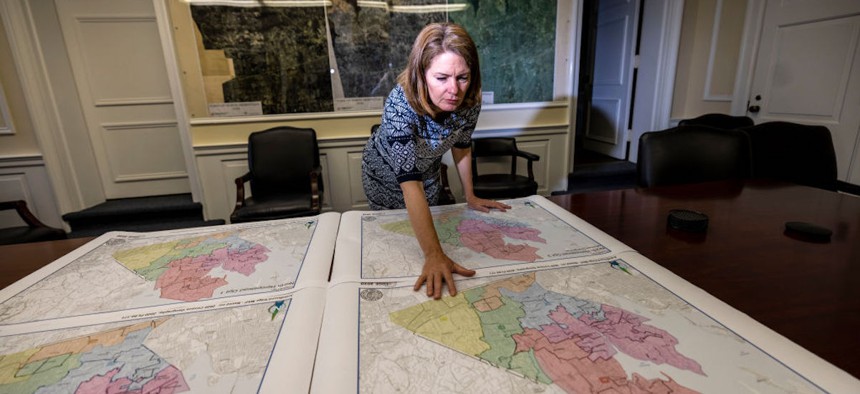 North Hempstead, New York, Supervisor Jennifer DeSena in her office June 9, 2022 with four different proposed maps, which were recommended by the town's redistricting commission. The new maps could alter the landscape of the town and who gets elected. 