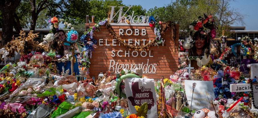 The Robb Elementary School sign was covered in flowers and gifts following the mass shooting in 2022.