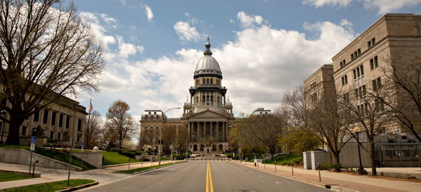 The Illinois State Capitol building stands among empty streets in Springfield, Illinois, on April 9, 2020. 