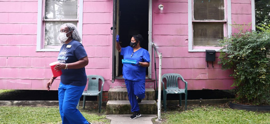 Nurses depart a home after administering a vaccine dose to resident inside on Aug. 17, 2021 in Baton Rouge, Louisiana. 