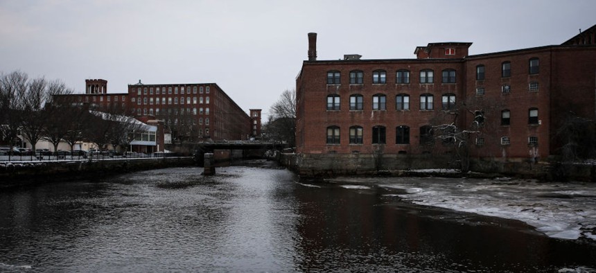 An old industrial building sits along the bank of the Cocheco River in Dover, New Hampshire, on Feb. 9, 2020.