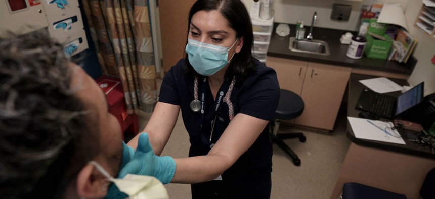 Dr. Sarah Nadia Ali, director of infectious diseases at Marys Center, works with a patient on March 17, 2023, in Washington, D.C. Ali is concerned about rising syphilis rates and says that penicillin is an effective and affordable treatment.