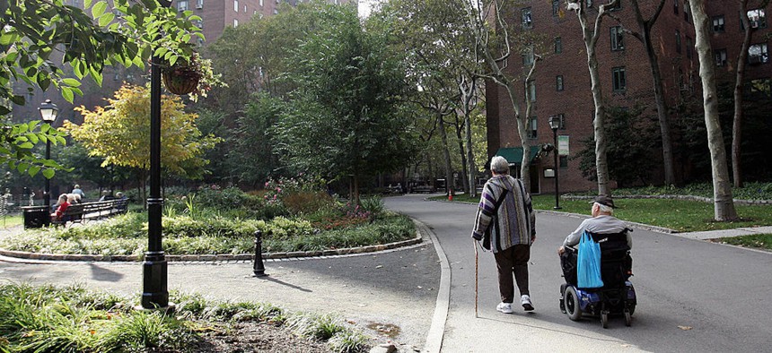 An elderly couple walk in a park in Stuyvesant Town on Oct. 18, 2006, in New York.