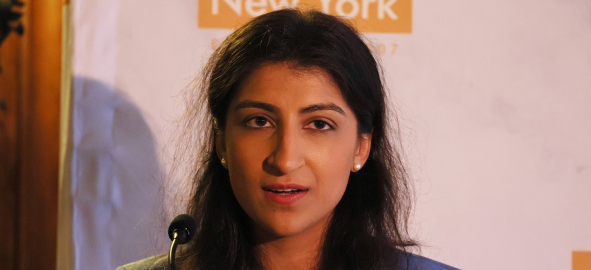 FTC Chair Lina Khan, shown here speaking at Economic Club of New York in July 2023, is looking to expand the authorities her agency has to target fraudsters who use impersonation in scams.
