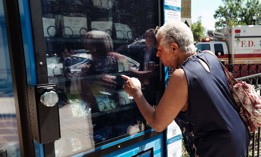 Rose Meredith uses a new vending machine in Brooklyn that will disperse fentanyl test strips and naloxone as well as hygiene kits, maxi pads, Vitamin C, and COVID-19 tests for free on June 5, 2023, in New York City. 