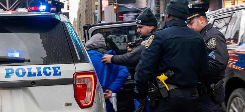  Police make an arrest in Time Square of a street performer on January 31, 2024, in New York City. 