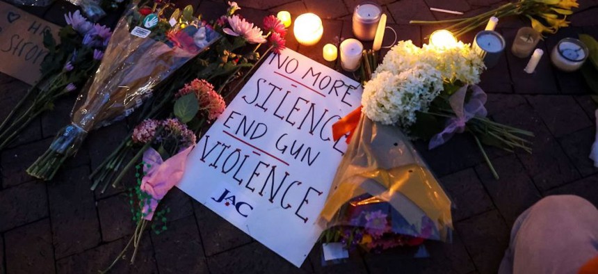 An anti-gun violence sign is seen at a candlelight vigil in Highland Park, suburb of Chicago, Illinois, on July 5, 2022. 