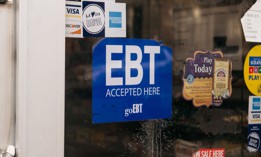  A sign alerting customers about SNAP food stamps benefits is displayed at a Brooklyn grocery store on Dec. 5, 2019, in New York City.