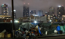 Tents that shelter homeless people line the sidewalk on January 20, 2024 in Los Angeles.