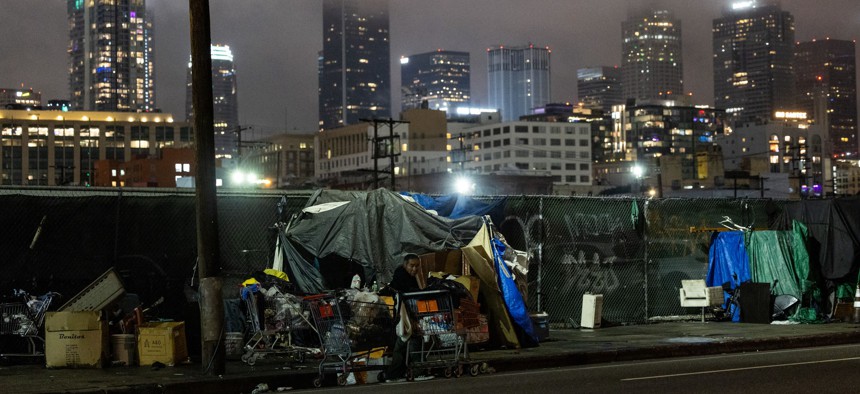 Tents that shelter homeless people line the sidewalk on January 20, 2024 in Los Angeles.