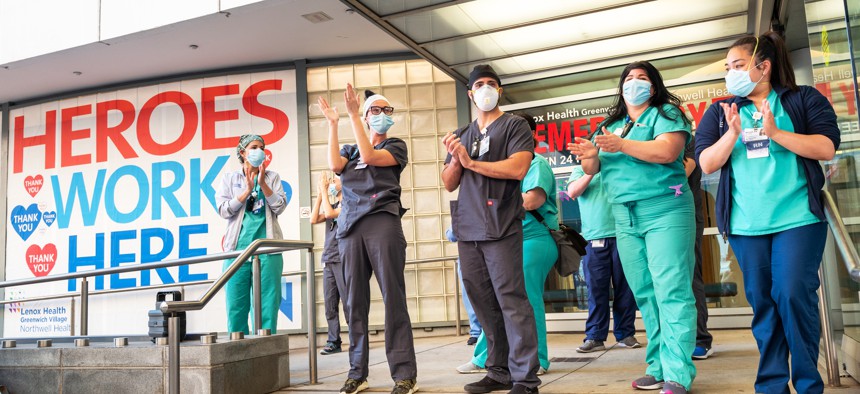  Health care workers are greeted to cheers and thanks for their essential service during the COVID-19 pandemic in New York City