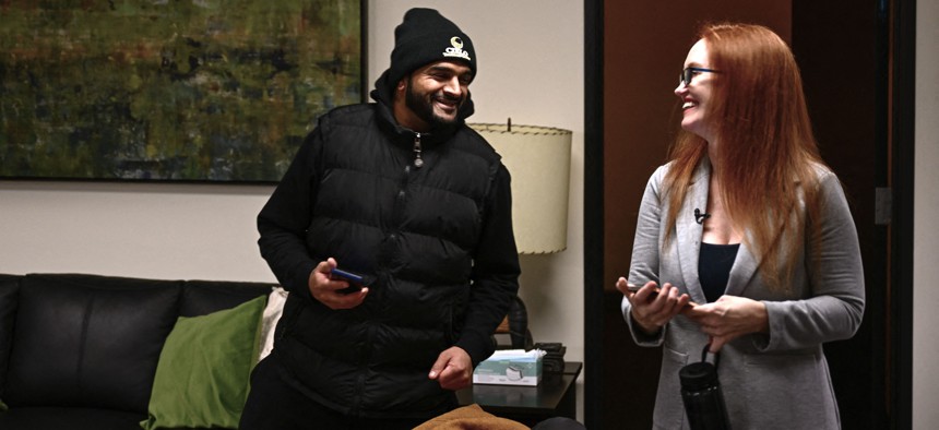 Solara Salazar (R), founder and executive director of Cielo Treatment Center, talks with Shilain Patel, who confronted addiction issues and now works as a residential advisor in a transitional housing facility, at the Cielo Treatment Center for drug addiction rehabilitation and mental health in Portland, Oregon on January 24, 2024.