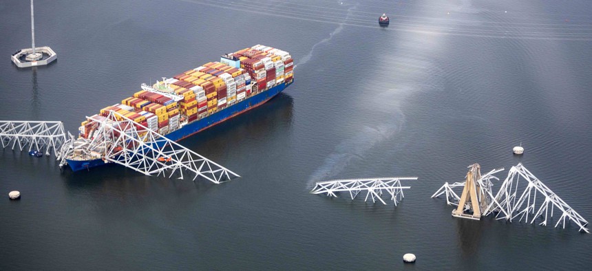 In an aerial view, the cargo ship Dali is seen after running into and collapsing the Francis Scott Key Bridge in Baltimore, Maryland.