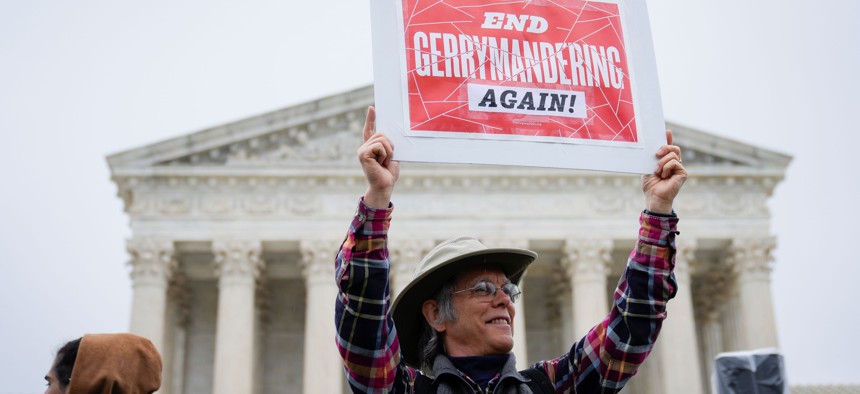 Voting rights activists rally outside the U.S. Supreme Court  during oral arguments in the Moore v. Harper case, which related to the redrawing of congressional maps by the North Carolina GOP-led state legislature following the 2020 Census. The map was struck down by the state supreme court for partisan gerrymandering that violated the state constitution.  December 7, 2022 in Washington, DC. 