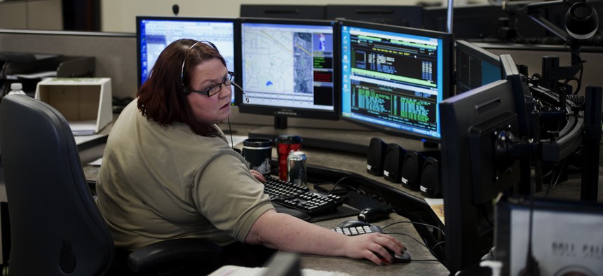 Christy Clark, a 911 Public Safety Dispatcher at the Washington County Law Enforcement Center in Stillwater, takes a 911 call. 