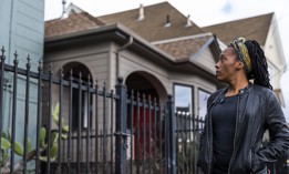Moms 4 Housing activist Dominique Walker surveys a vacant home located along the same street where she and other homeless or insecurely housed mothers took over a vacant home, in Oakland, California on January 28, 2020, in a bold, high-profile protest against homelessness. 