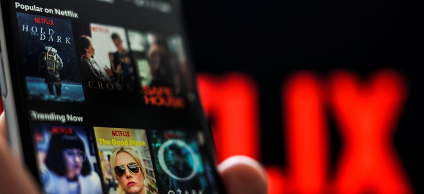 The Netflix application is seen on an Apple iPhone.