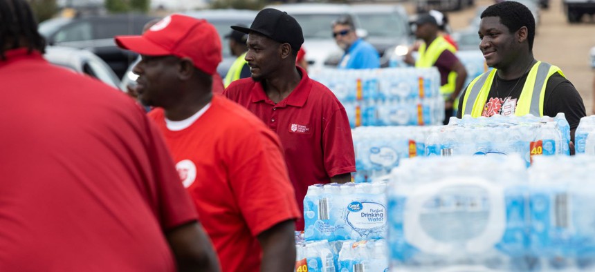 The Salvation Army of Jackson and Walmart distribute bottled water at a Walmart location on August 31, 2022 in Jackson, Mississippi. Jackson was experiencing a third day without reliable water service after river flooding caused the main treatment facility to fail. 