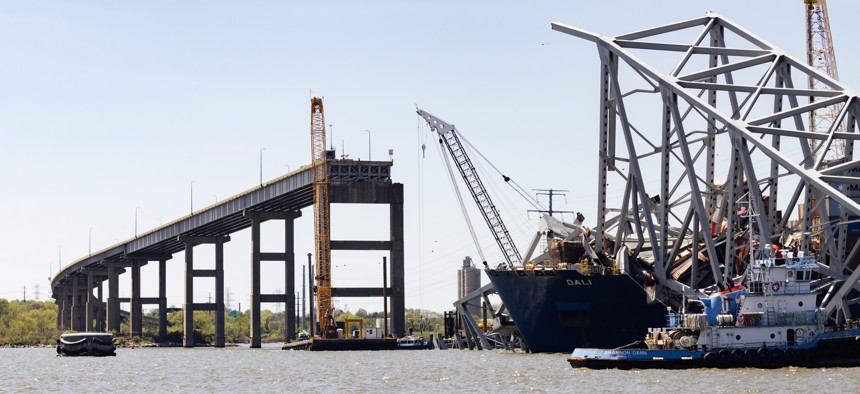 The bow of the Dali cargo ship and the collapsed Francis Scott Key Bridge sit in the water in the Patapsco River in Baltimore.