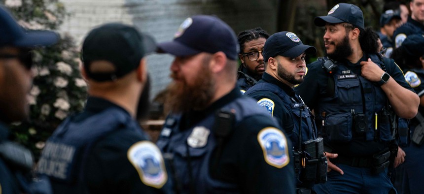 Law Enforcement stand along H Street after clearing out a Pro-Palestinian encampment at George Washington University's University Yard on May 8, 2024 in Washington, D.C. 