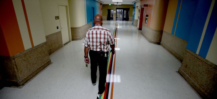 Bill Walton, the facilities operations manager of the LA+USC Medical Center walks down a hallway in the Los Angeles County General Hospital. L.A. County Supervisor Hilda Solis has unveiled plans to convert the building into low- and middle-income housing. 
