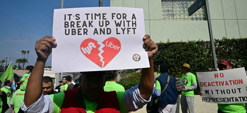 Members of the Rideshare Drivers United organization protest against Uber and Lyft during a demonstration in Los Angeles in February.