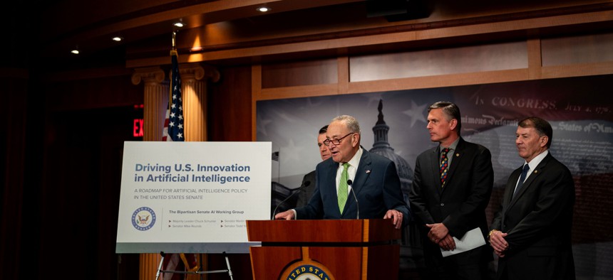  Senate Majority Leader Chuck Schumer (D-NY), flanked by Sen. Todd Young (R-IN), Sen. Martin Heinrich (D-NM) and Sen. Mike Rounds (R-SD), speaks during a news conference at the U.S. Capitol on May 15, 2024 in Washington, DC. A bipartisan Senate working group focused on artificial intelligence released a policy roadmap, which encourages the executive branch and appropriators to support $32 billion in annual innovation funding.