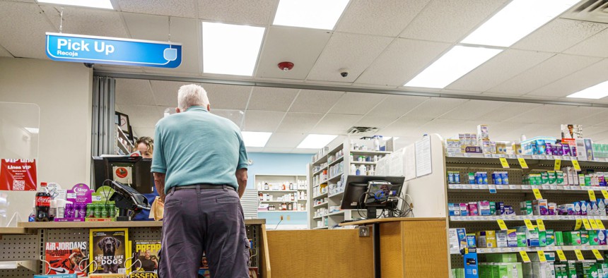 Senior man picking up a prescription at Walgreens in Miami Beach, Florida.   Insurance companies, and the pharmacy benefit management companies that handle prescriptions for them, often refuse to cover a specific drug until after the patient has tried cheaper alternatives, a process known as step therapy. 