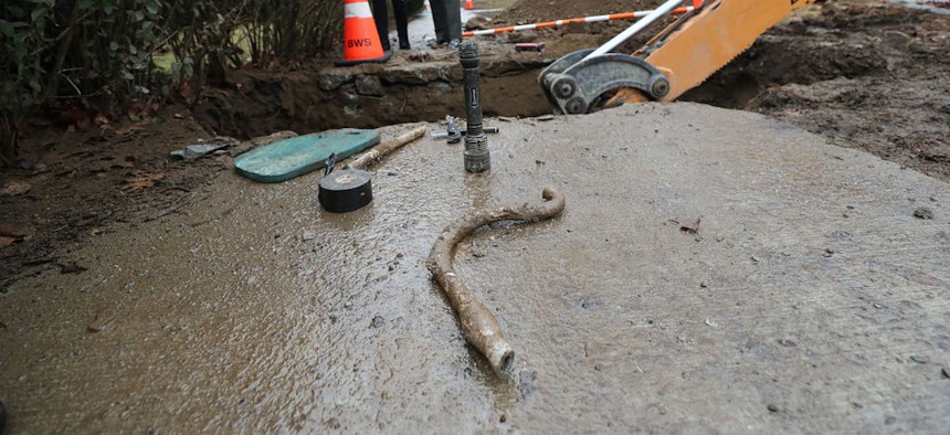 Lead pipes are removed from a Boston home on Feb. 28, 2024. 