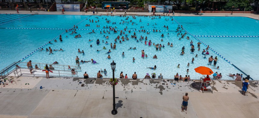 People swim at the Astoria Pool on the opening day of New York City's public swimming pools in the borough of Queens on June 27, 2024, in New York City. 