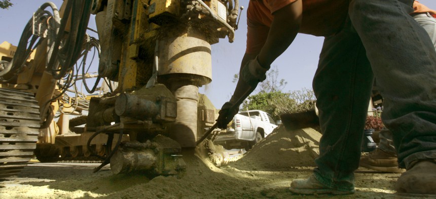 Crews must drill a borehole to install networked geothermal, which heats and cools nearby homes using the ground as a battery.