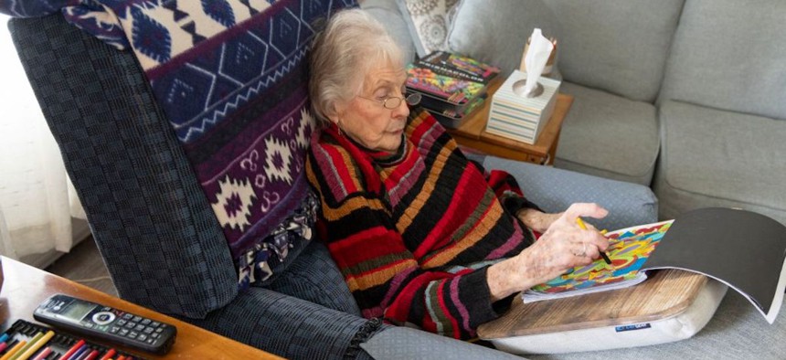 An 89-year-old woman uses an adult coloring book to reduce anxiety and improve brain function in Dover, Delaware. 